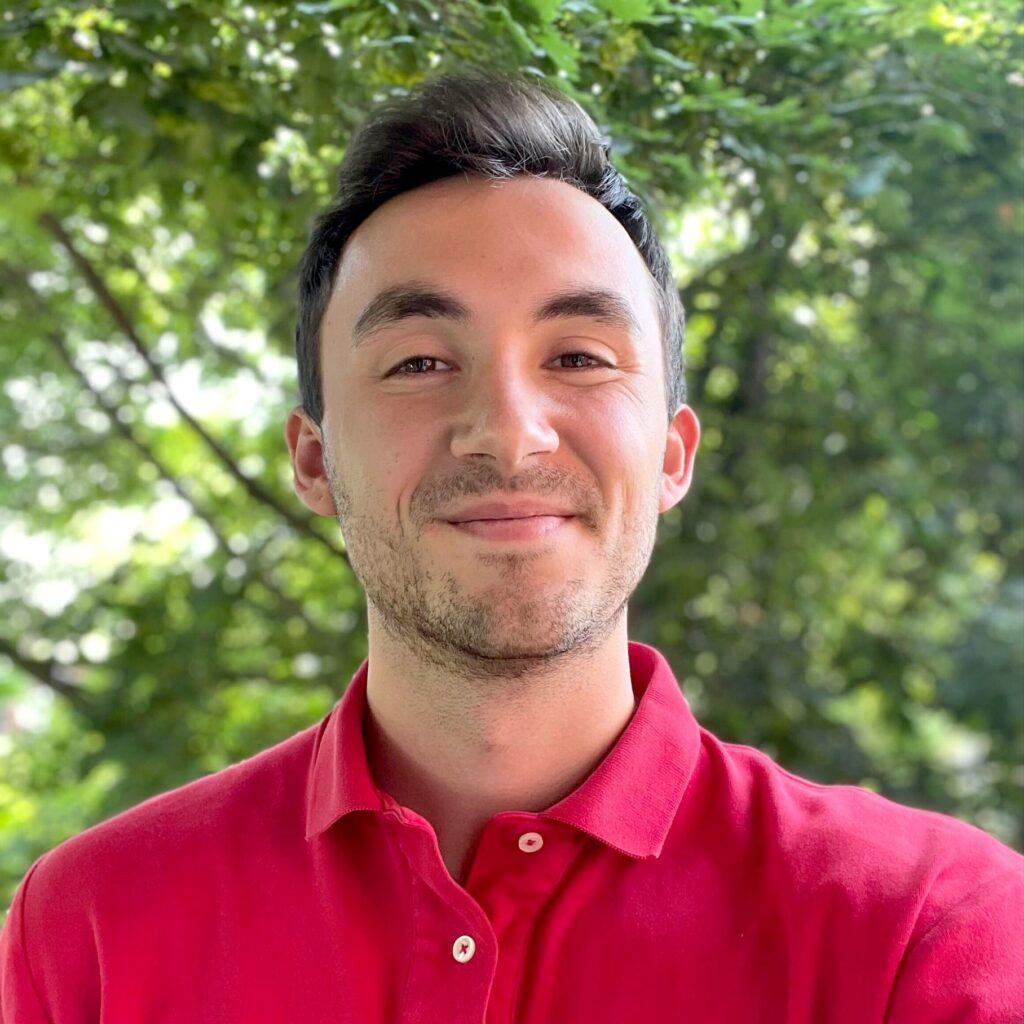 Photo of Alex Frandsen in a park smiling