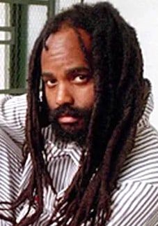 Mumia Abu-Jamal, Journalist, U.S. political prisoner in prison uniform in his cell